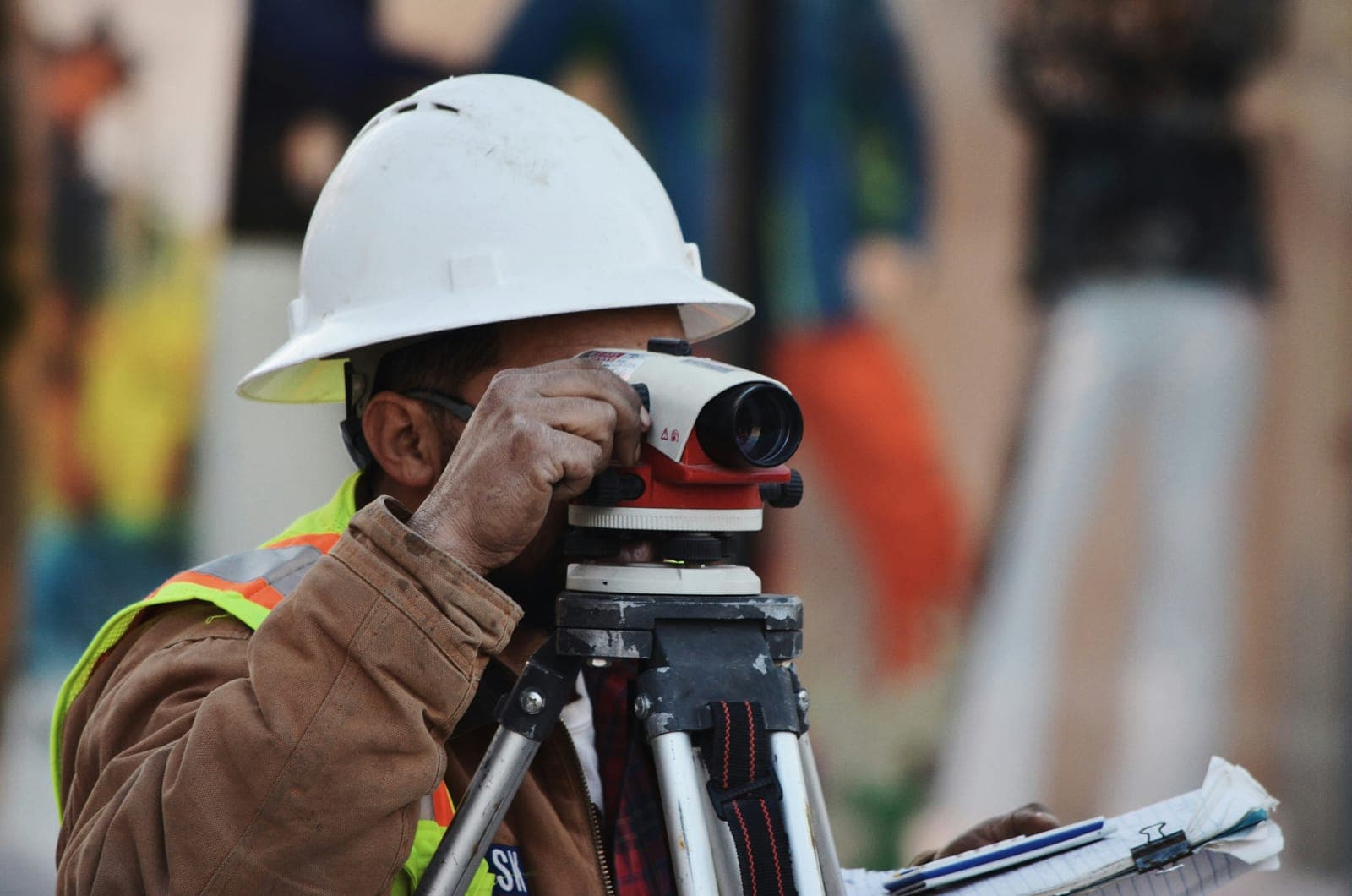 Professional land surveyor operating high-precision equipment